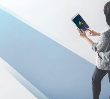photo illustration of woman walking on blue pathway carrying tablet with arrow on screen