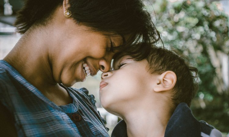 mom smiling down at son