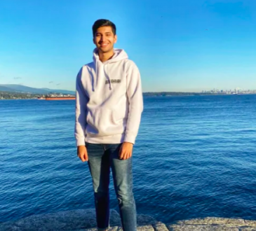 student standing at vancouver waterfront