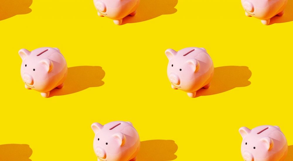 piggy banks on yellow background