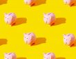 piggy banks on yellow background