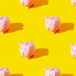piggy banks on yellow background