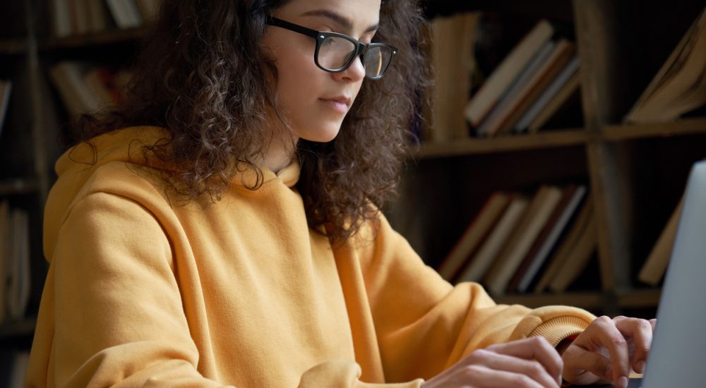 female student working on computer