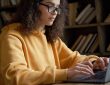 female student working on computer