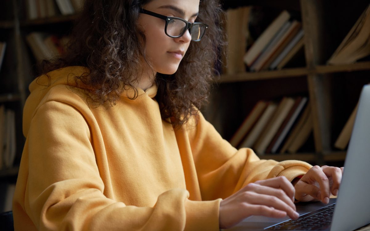 female student working on computer