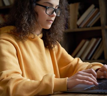 female student working on computer