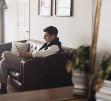 man working on couch