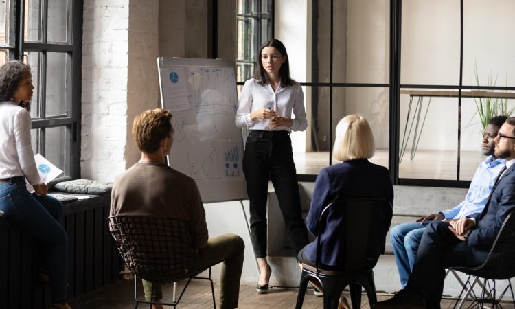 woman giving presentation to colleagues