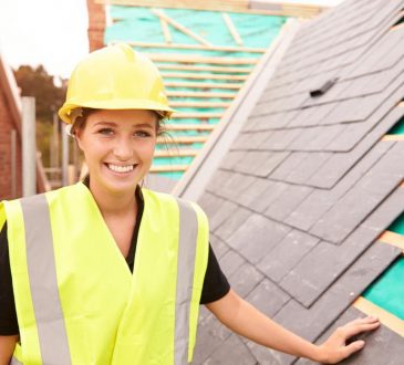 woman working on rooftop construction site