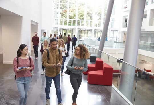 students walking in university building