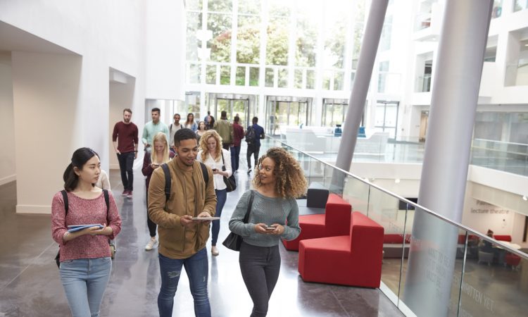 students walking in university building