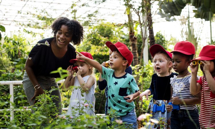 Teacher and kids learning gardening