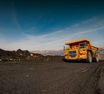 truck in an iron ore quarry transports raw materials.