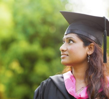 Indian female student wearing graduation cap.