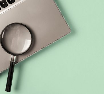 Magnifying glass on laptop