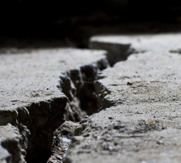 Cracked road concrete close up