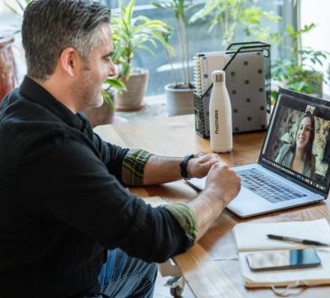 Man taking video call in home office.