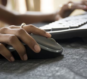 Closeup of hand on computer mouse