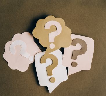 Paper cutouts of question marks