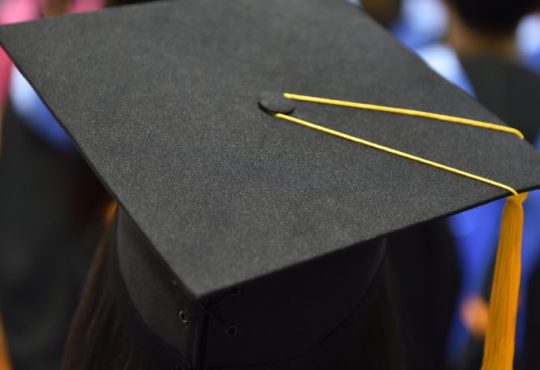 Close up of graduation cap from behind