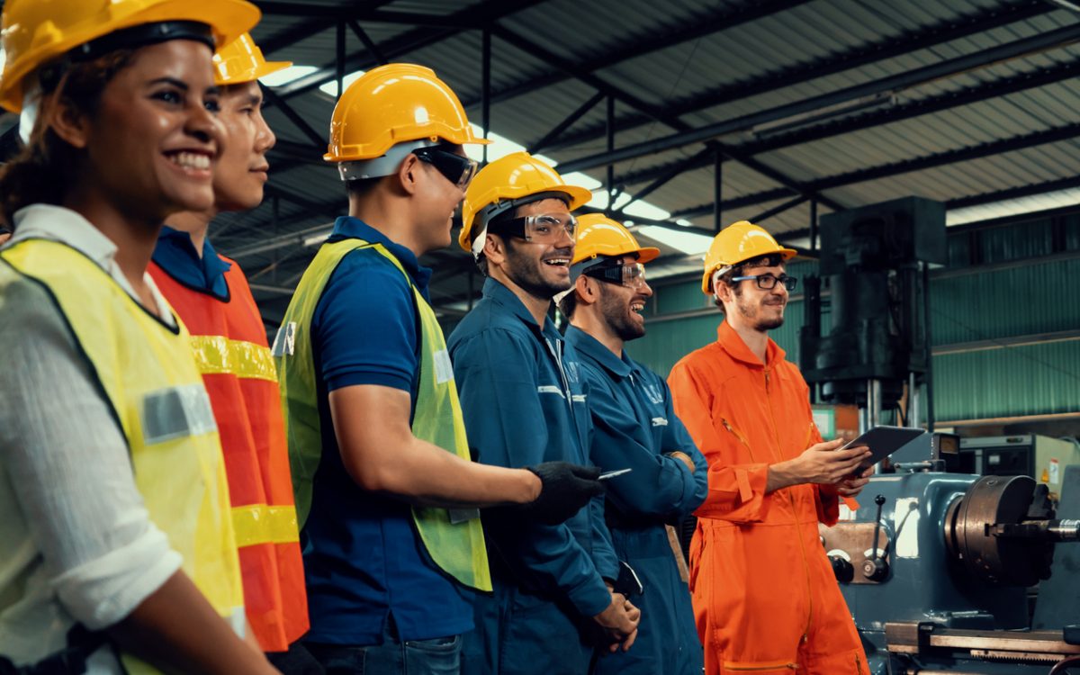 Workers wearing hard hats in industrial setting