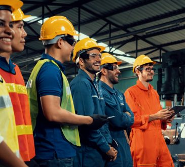 Workers wearing hard hats in industrial setting