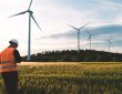 Engineer working at alternative renewable wind energy farm