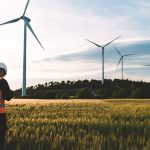 Engineer working at alternative renewable wind energy farm