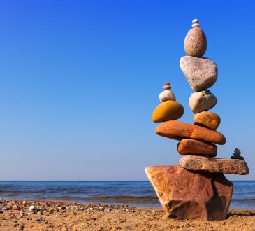 Pile of balancing rocks on beach