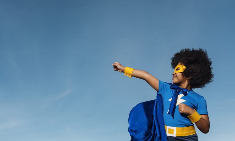 Kid wearing superhero costume