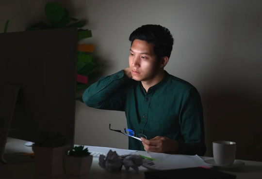Man working at desk late at night