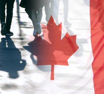 The National Flag of Canada and shadows of people, concept picture