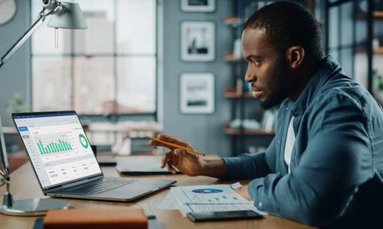 Black man working on laptop
