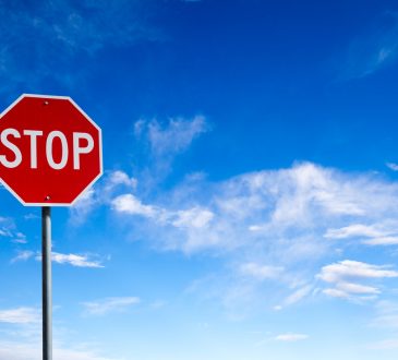 stop sign with blue sky background
