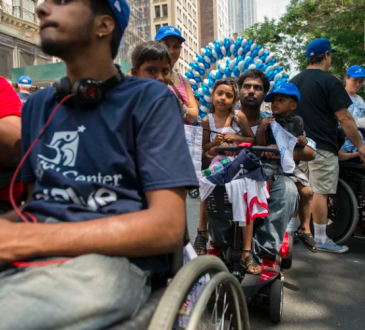 People participate in a disability pride parade in New York City.