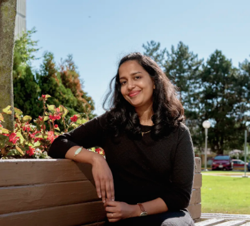 Woman sitting on bench outside