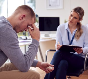 Woman meeting with man who is crying