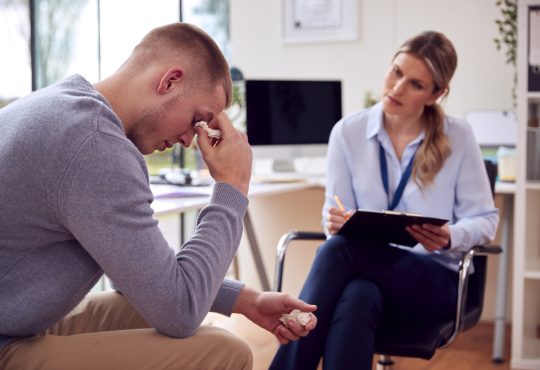 Woman meeting with man who is crying