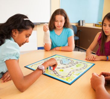 Students in a classroom playing an educational game