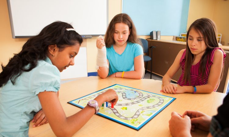 Students in a classroom playing an educational game