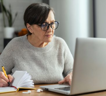 Mature woman using laptop.