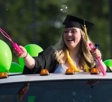 High school graduates from Windsor Secondary in North Vancouver, B.C. take part in a graduation parade.