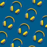 Pattern of multi-colored headphones on blue background.