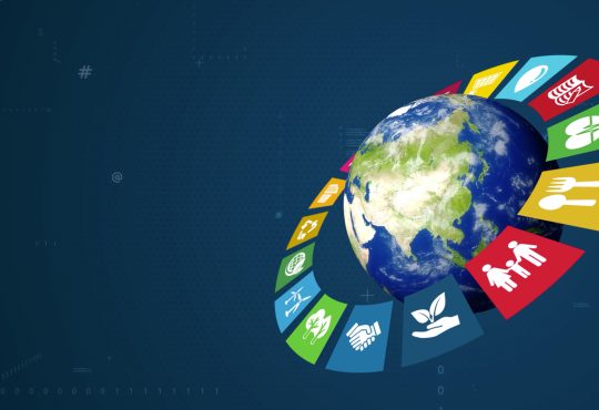 SDG icons surrounding globe on dark blue background