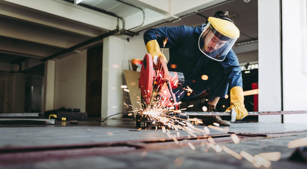 Craftsman Welding is Cutting Steel Work in Fabrication Workshop