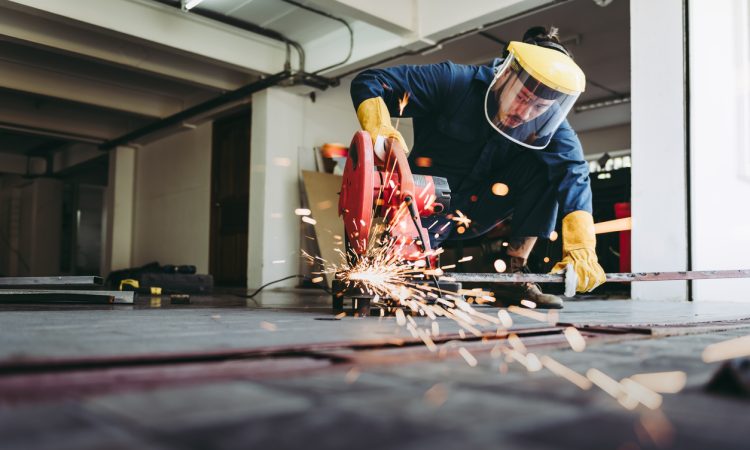 Craftsman Welding is Cutting Steel Work in Fabrication Workshop