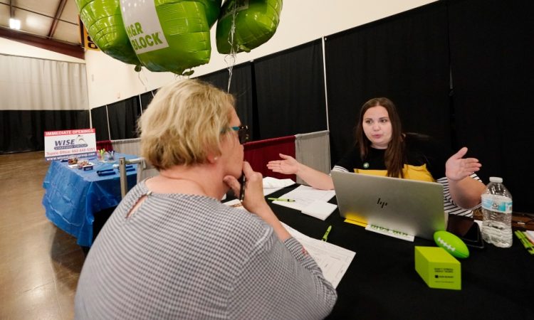 People talking at career fair.