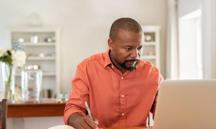 Man working on laptop at desk