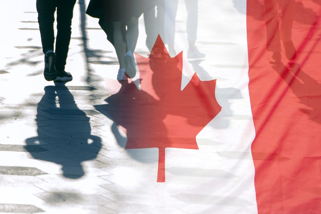 Canada flag overlaid on image of pedestrians walking