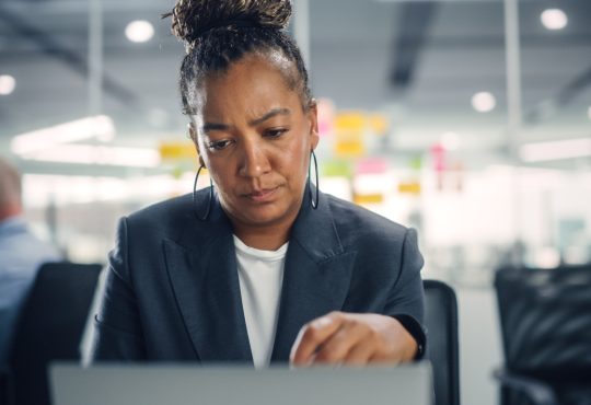 Woman working at computer in office